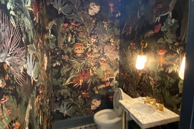 Powder room - mid-sized powder room idea in Philadelphia with marble countertops and a floating vanity
