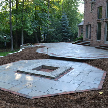 Lannon stone fire pit in a Bluestone patio