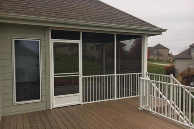 Inspiration for a mid-sized backyard deck remodel in Omaha