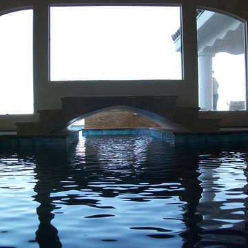 Indoor pool with bridge to outdoor pool