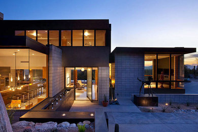 Large modern gray two-story concrete flat roof idea in Phoenix