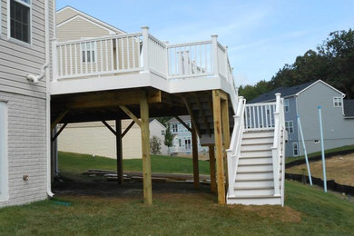 Mid-sized backyard deck photo in DC Metro with no cover