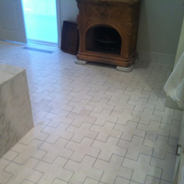 Master bath renovation with hand-cut marble