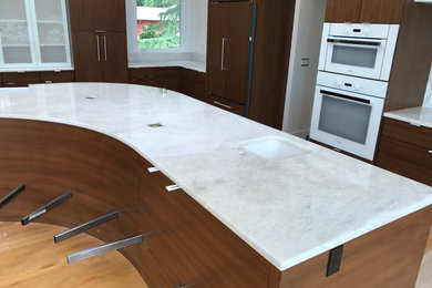 Large transitional u-shaped beige floor kitchen pantry photo in Portland with a drop-in sink, quartzite countertops, white backsplash, white appliances, an island and white countertops