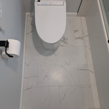 Modern Bright Monochromatic Tub & Shower Remodel with Calacatta Porcelain Tile