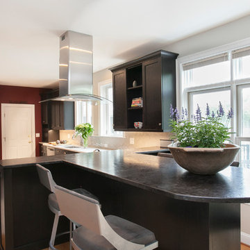 Leathered Granite Peninsula Visually Extends the Kitchen