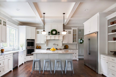 Inspiration for a large country u-shaped separate kitchen in St Louis with a farmhouse sink, shaker cabinets, white cabinets, quartzite benchtops, white splashback, timber splashback, stainless steel appliances, with island, brown floor, grey benchtop and dark hardwood floors.