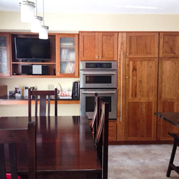 Custom natural finished Gummy Cherry cabinets with Cambria 'Edinborough' Quartz
