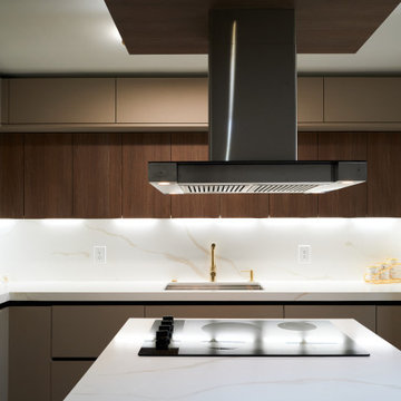 Detailed View of Kitchen Countertop with Cooktop and Lighting in South Florida
