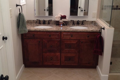 Photo of a large transitional master bathroom in DC Metro with raised-panel cabinets and dark wood cabinets.