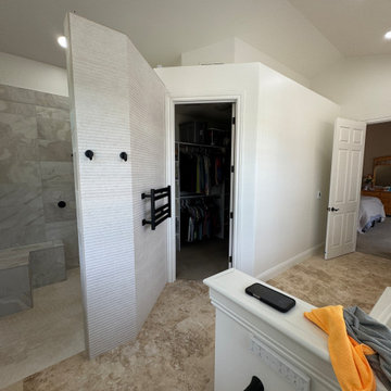 Curd-less walk-in shower; heated floors in bathroom + shower+bench LED