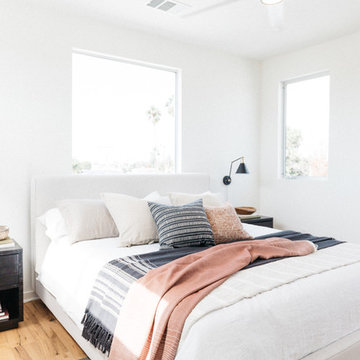 Round Black Mirror in Pink and Black Bedroom with Tribal Patterns