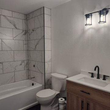 Custom Tile Tub Surround with Black Herringbone Mosaics