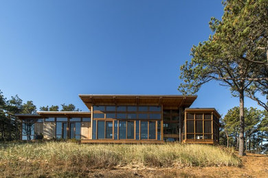 Mid-sized modern brown one-story wood exterior home idea in Boston