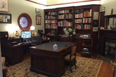 This is an example of a mid-sized traditional home office in Sydney.