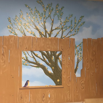 Painted tree scene with painted clubhouse wall. Youth Mural.