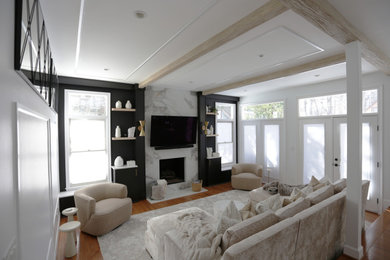 Inspiration for a large farmhouse open concept light wood floor, beige floor and exposed beam living room remodel in DC Metro with white walls, a standard fireplace, a stone fireplace and a wall-mounted tv