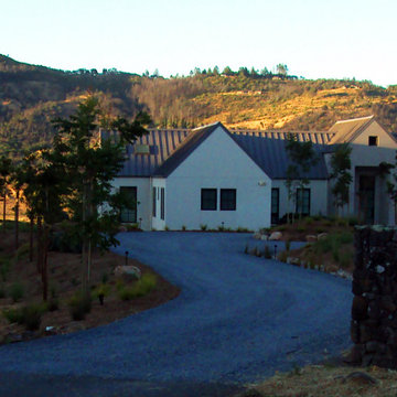 Blue Shale Entry Drive with stone columns and Pistache trees