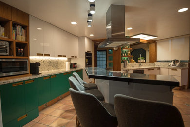 Example of a mid-century modern kitchen design in Mexico City