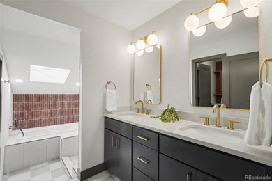 Mid-sized minimalist master white tile and ceramic tile ceramic tile and double-sink bathroom photo in Denver with flat-panel cabinets, dark wood cabinets, solid surface countertops, white countertops and a built-in vanity