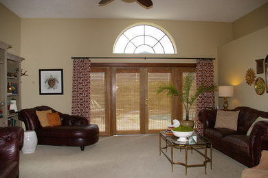 Large elegant open concept carpeted living room photo in Tampa with beige walls, no fireplace and a media wall