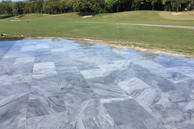 Patio - mid-sized modern backyard tile patio idea in Tampa with no cover