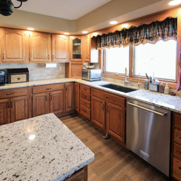 Oak Country Kitchen Update Reusing Existing Cabinetry and Adding Color Accent