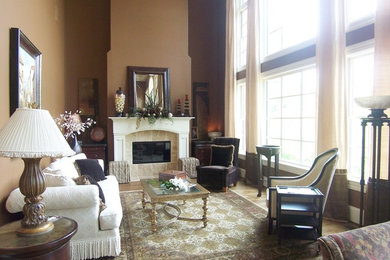 Elegant living room photo in Other with a tile fireplace