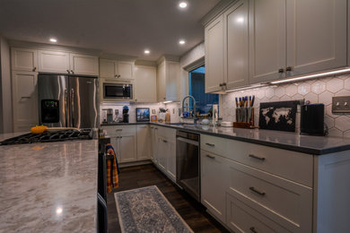 Mid-sized minimalist l-shaped eat-in kitchen photo in Portland