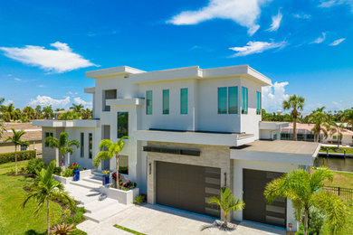 Inspiration for a contemporary white flat roof remodel in Tampa