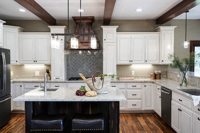 Example of a mid-sized farmhouse l-shaped brown floor and medium tone wood floor eat-in kitchen design in Other with an undermount sink, raised-panel cabinets, white cabinets, gray backsplash, ceramic backsplash, stainless steel appliances and an island