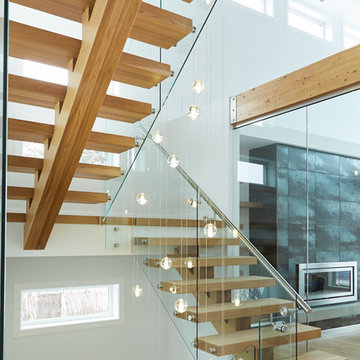 white oak mono stringer with stainless steel hand rail