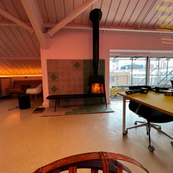 Modern, Freestanding Wood-Burning Stove Featuring Long Bench - Freestanding Stoves
