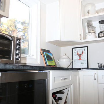 Custom Pantry Workspace with Black Countertop and Under Cabinet Storage