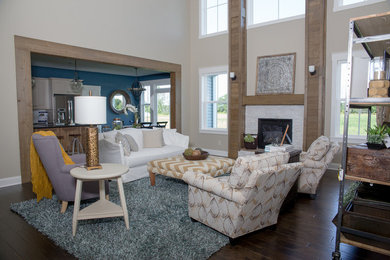 Family room - transitional open concept dark wood floor family room idea in Cleveland with beige walls, a standard fireplace and a stone fireplace