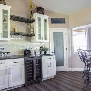 Spacious kitchen remodel using warm taupe, white and brown tones