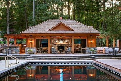 Large transitional backyard patio photo in DC Metro with a fire pit and a pergola