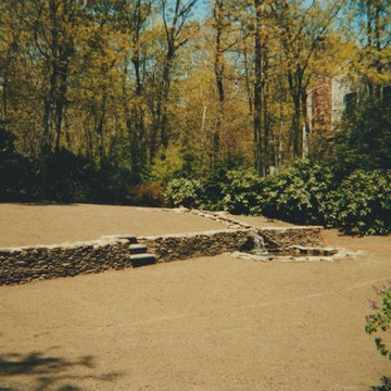 stone wall with waterfall and step