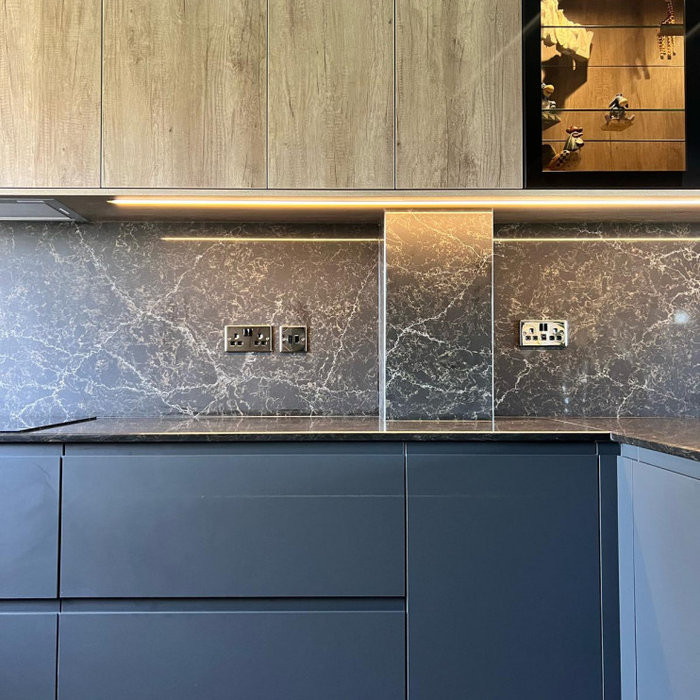 Eat-in kitchen - mid-sized contemporary u-shaped vinyl floor and brown floor eat-in kitchen idea in Other with a drop-in sink, flat-panel cabinets, dark wood cabinets, quartzite countertops, brown bac