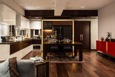 Open concept kitchen - mid-sized contemporary l-shaped open concept kitchen idea in Hong Kong with an undermount sink, flat-panel cabinets, white cabinets and black appliances