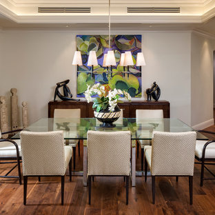 Design ideas for a tropical open plan dining in Miami with grey walls and dark hardwood floors.