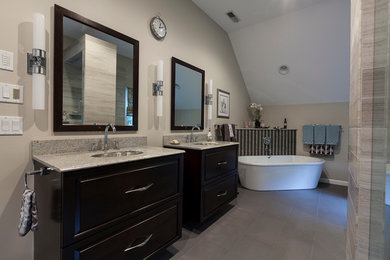 Bathroom - large contemporary master gray tile and porcelain tile ceramic tile bathroom idea in New York with flat-panel cabinets, dark wood cabinets, a two-piece toilet, beige walls, an undermount sink and granite countertops