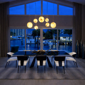 Waterfront Dining Room with Statement Pendant Lighting