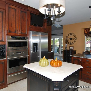Kitchen Knotty cherry with black wrought iron accents