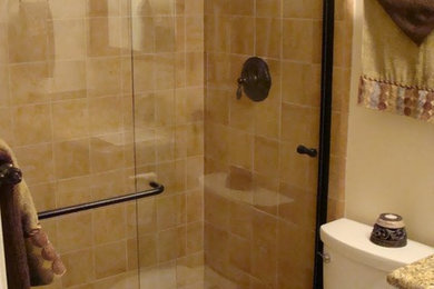 Inspiration for a mid-sized transitional beige tile bathroom remodel in San Diego with a two-piece toilet, beige walls and granite countertops