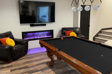 Minimalist vinyl floor family room photo in Omaha