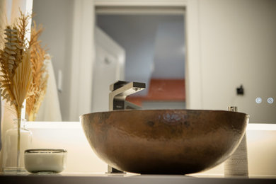 Bathroom - small contemporary beige tile and porcelain tile porcelain tile and gray floor bathroom idea in Edmonton with flat-panel cabinets, dark wood cabinets, a bidet, white walls, a vessel sink, quartz countertops, white countertops and a floating vanity