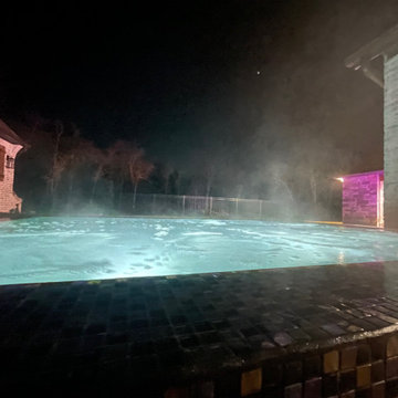 Polymer vinyl liner pool w/concrete spillover spa & automatic pool cover