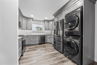 Inspiration for a transitional laundry room remodel in St Louis