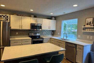 Inspiration for a modern eat-in kitchen remodel in Seattle with quartzite countertops and an island